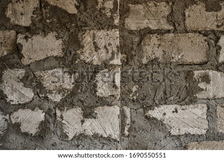 Repair and construction. The old wall. Wall of brick, stone and concrete. Stone and cement background