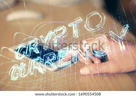 Double exposure of blockchain business sketch hologram and woman holding and using a mobile device.