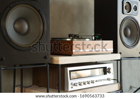 HiFi system with turntable, amplifier and speakers in a studio Royalty-Free Stock Photo #1690563733