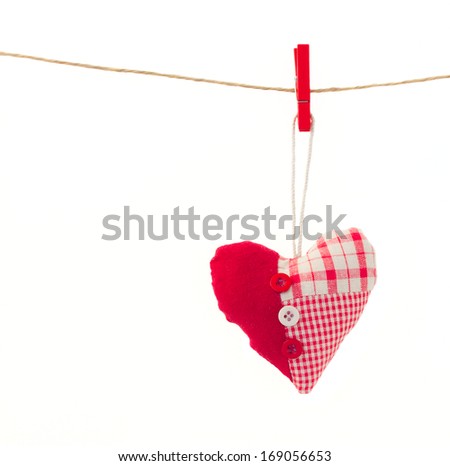 one  hanging red  heart hanging on rope isolated on white background