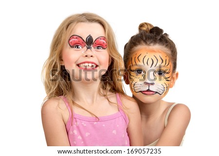 Beautiful young girls with painted faces, tiger and ladybug Royalty-Free Stock Photo #169057235