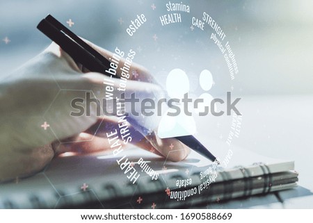 Creative concept of people icons and woman hand writing in notebook on background. Life and health insurance concept. Multiexposure
