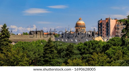 Panorama of Madrid cityscape with the colorful Byzantine style dome of the Church of or Iglesia Santa Teresa y San Jose in city center, Madrid, Spain