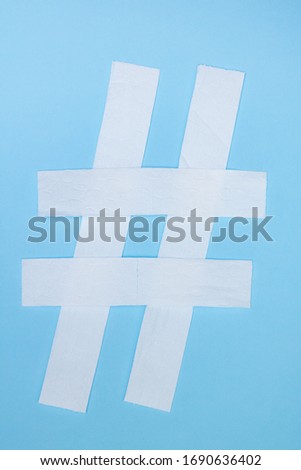 Toilet paper hashtag sign on a blue background
