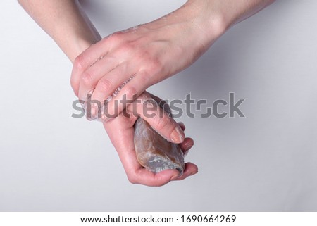 hands are washed with tar soap. personal hygiene and cleanliness help in the fight against germs, coronavirus bacteria and viruses obtained after bodily contact and handshakes Royalty-Free Stock Photo #1690664269