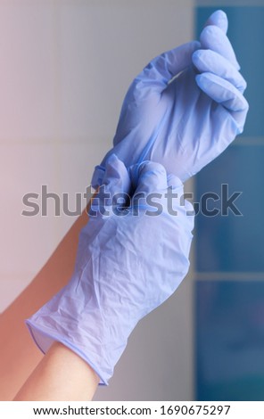 Woman's hands in rubber medical gloves. Infection protection. Cosmetology procedures. Doctor in gloves. Medical worker. It is protected from viruses, diseases, infections. Disinfection.