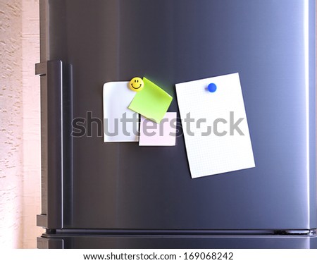 Empty paper sheets on fridge door