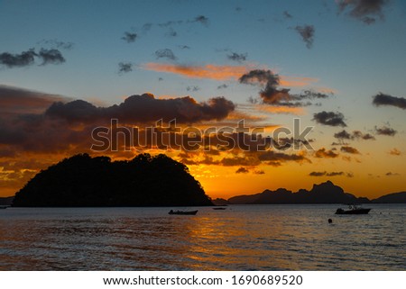 The sun sets over the island, Philippines.