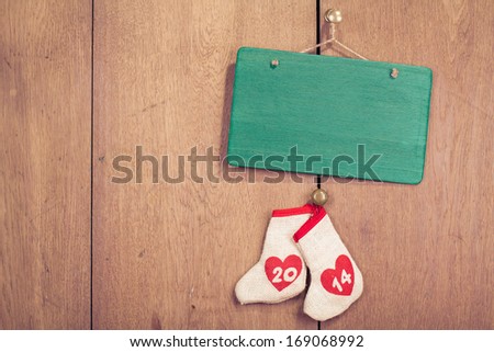 New Year date and signboard front wooden background