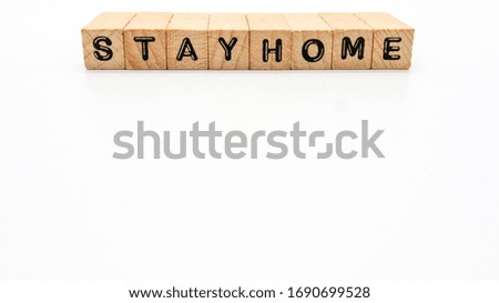 Wooden Text Block of "STAY HOME" on Isolated Background