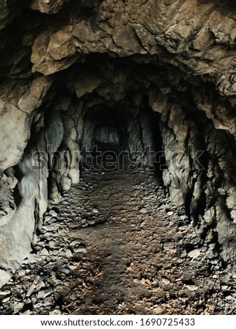 entrance to the cave.  natural tunnel.  hole in the mountains