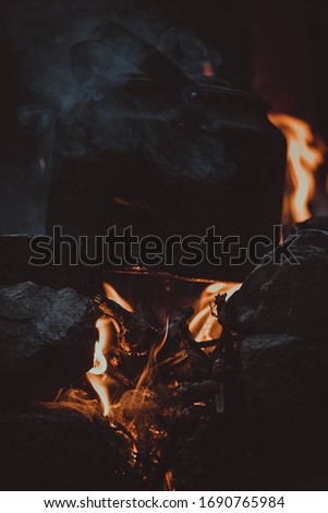 kettle on a campfire in the mountains