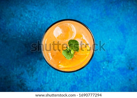 Fresh cocktail with vodka and orange juice on the rustic background. Selective focus. Shallow depth of field.