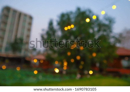 Blurred background of garden with abstract bokeh light.