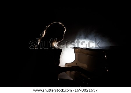 Pianist musician piano music playing. Musical instrument grand piano with woman performer.