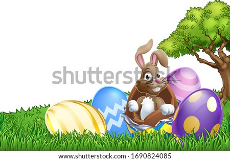 Easter bunny rabbit breaking out of a chocolate Easter egg background cartoon