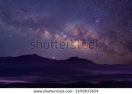 Milky way galaxy at mountain with stars and space dust in the universe, long speed exposure, Night landscape with colorful Milky Way, Starry sky with hills, Beautiful Universe, Space background.