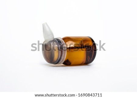 Closed medicine bottle with dropper isolated on white background.Little dropper bottle.High resolution photo.