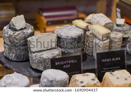 A large selection of different french and italian cheeses on the counter of a small store.Fresh Food Buffet Brunch Catering Dining Eating Party Sharing Concept