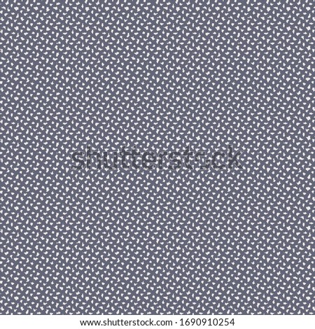 Flecked blanket in dark blue and ivory. Tweed fabric texture.