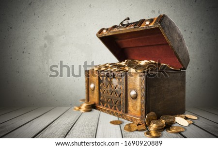 Open old vintage treasure chest with coin