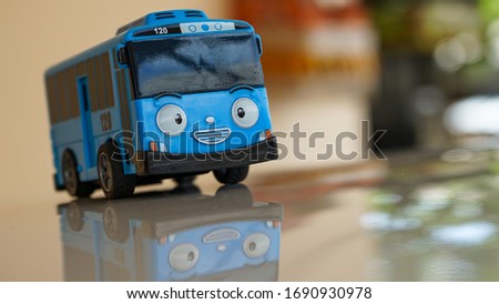 Close up of Toy bus shaped tayo on the table Royalty-Free Stock Photo #1690930978