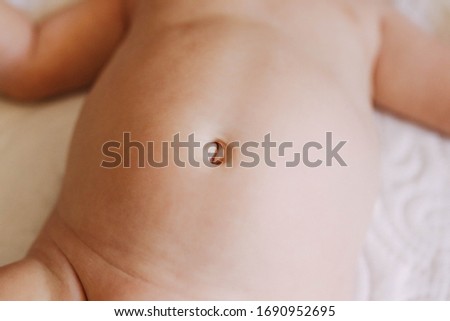 baby girl cute belly button  Royalty-Free Stock Photo #1690952695