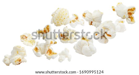 Flying popcorn, isolated on white background Royalty-Free Stock Photo #1690995124