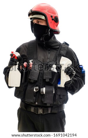 Concept Isolated portrait on white background man in a black military uniform in a red helmet with cleaning products in his hands
