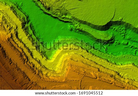 DEM - digital elevation model. Product made after proccesing pictures taken from a drone. It shows excavation site with steep rock walls Royalty-Free Stock Photo #1691045512