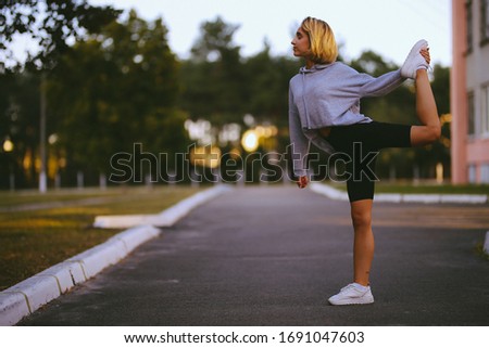 young beautiful girl athlete. girl athlete engaged in sports. A young girl is engaged in morning exercises. Athletic young woman doing morning exercises. Sport girl. vintage photo processing