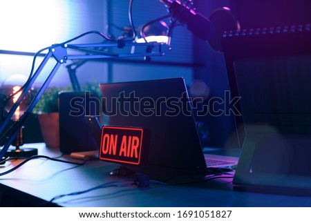 Live online radio broadcasting station desk with on air sign, entertainment and communication concept