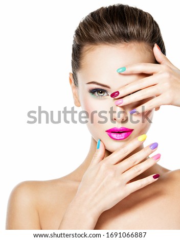 Beautiful woman  with colored nails and pink lips. Attractive stylish fashion model Royalty-Free Stock Photo #1691066887