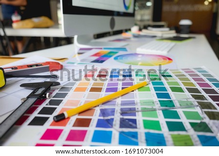 Engineers and creative artists work on table, work, consult, advise on choosing colors and materials, measuring size, choosing cool colors, soft tones, beautiful tones.