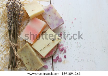 Colorful handmade soap concept. Natural handmade soap on a wooden background.Handmade natural eco soap, selective focus. Copy of the space, top view, background mode. Healthy skin. Wash their hands. Royalty-Free Stock Photo #1691091361