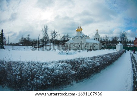 Pyatnitsky Compound of the Holy Trinity St. Sergius Lavra, Vvedensky church, freezing snowy day, blue sky, golden domes, winter lanscape Royalty-Free Stock Photo #1691107936