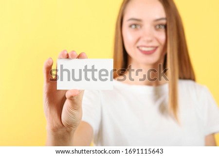 Business card in a female hand 