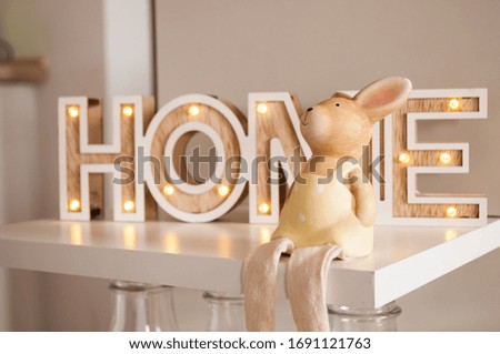 Easter bunny on a home text background