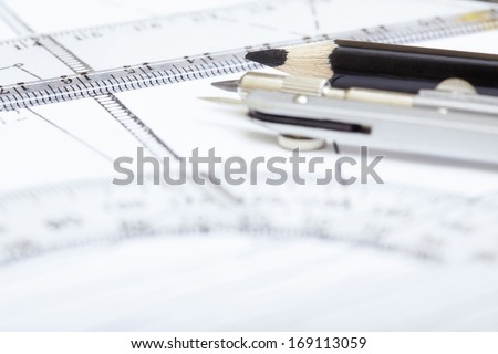 Scheme with drawing tools. Extremely close-up photo. Shallow depth of field