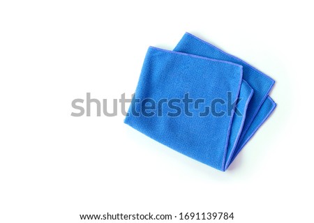Closeup blue duster microfiber cloth for cleaning isolated on white background . Top view. Flat lay. Clipping path. Royalty-Free Stock Photo #1691139784