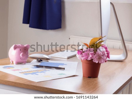 Office table with computer, smartphone, pen and house plant on white background, Creative workplace concept