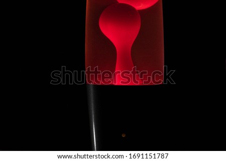 Red lava lamp with black background