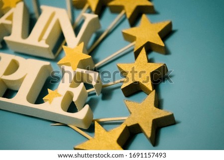 White letters with golden stars on a light and blue background. extruded polystyrene decor.blank for decoration, logo making
