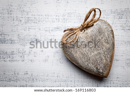 Heart on a wooden background. Vintage style.