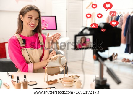 Beauty blogger filming make up tutorial at home