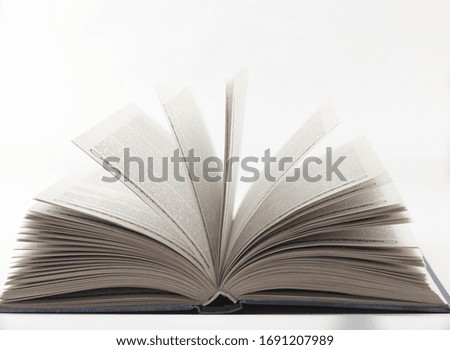 Old open book on white background with the pages open