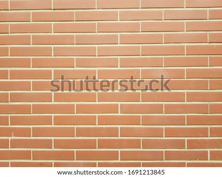 Light Orange brick wall tiles texture and background
