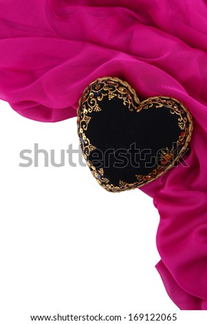Decorative black heart, on color fabric, isolated on white