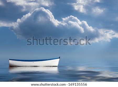 Concept image of loneliness, lacking direction, no leadership, rudderless, floating, listless or generally adrift without a goal Royalty-Free Stock Photo #169135556