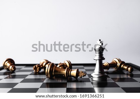 A chess king last stand as a true winner.Money game concept. Copy space. Royalty-Free Stock Photo #1691366251